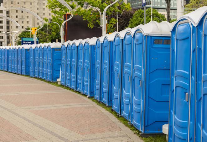 a row of portable restrooms at a fairground, offering visitors a clean and hassle-free experience in heath
